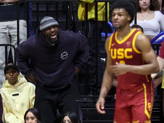 BERKELEY, CALIFORNIA - FEBRUARY 07: LeBron James #23 of the Los Angeles Lakers shouts to his son, Bronny James #6 of the USC Trojans, during Bronny's game against the California Golden Bears at Haas Pavilion on February 07, 2024 in Berkeley, California. (Photo by Ezra Shaw/Getty Images)