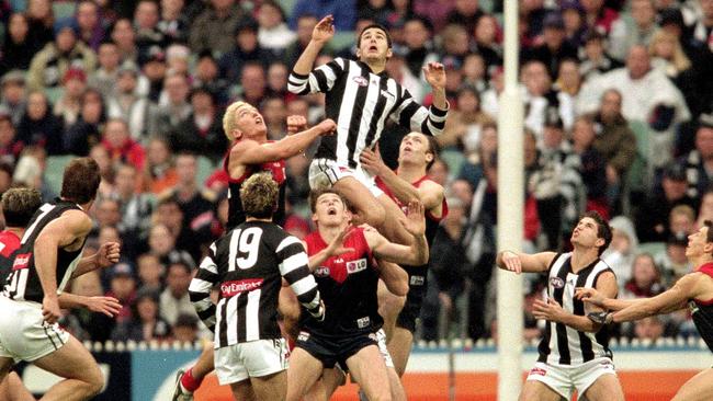 11/06/2001 Collingwood vs Melbourne.  Collingwood's Chris Tarrant takes a huge mark over the top of the pack.football