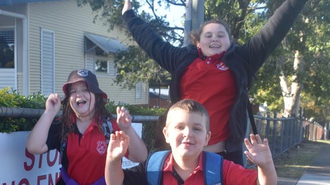 Gympie students Sonja Gourley, Ivy Robertson and Davis Mahoney (front) celebrate the return to normal school at Gympie West State School yesterday. Picture: Frances Klein