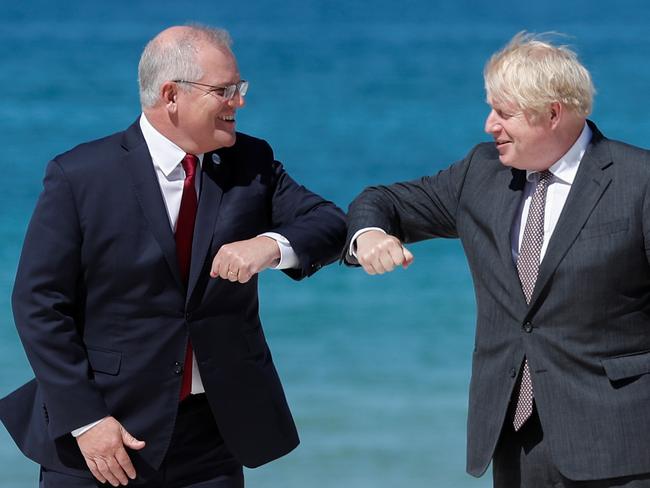 Britain's Prime Minister Boris Johnson greets Australia's Prime Minister Scott Morrison during an official welcome at the G7 summit in Carbis Bay, Cornwall. Picture: Getty Images