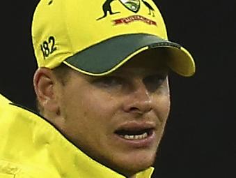MELBOURNE, AUSTRALIA - FEBRUARY 14: Steve Smith of Australia celebrates after taking a catch to dismiss Jos Buttler of England off the bowling of Mitch Marsh of Australia during the 2015 ICC Cricket World Cup match between England and Australia at Melbourne Cricket Ground on February 14, 2015 in Melbourne, Australia. (Photo by Ryan Pierse/Getty Images)