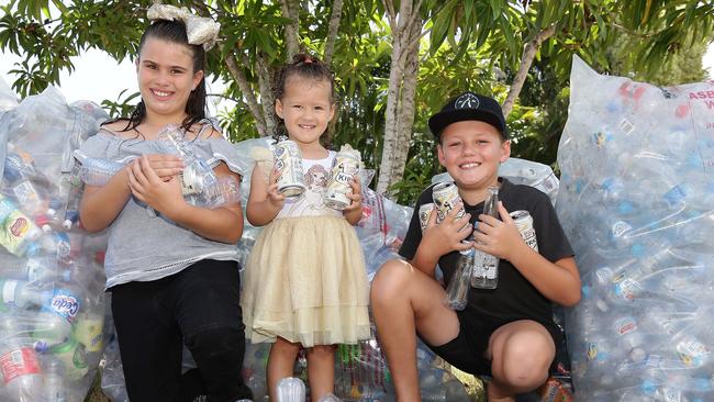 Gabriella, 10, Liliana, 2, and Ollie, 9, with some of the cans and bottles they collected. Picture: Tertius Pickard.