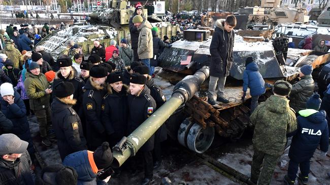 Visitors inspect a US-made M1 Abrams battle tank at an exhibition of Western military equipment captured by Russian forces in Kharkiv and Sumy regions of Ukraine in in Saint Petersburg on Monday. Picture: AFP)