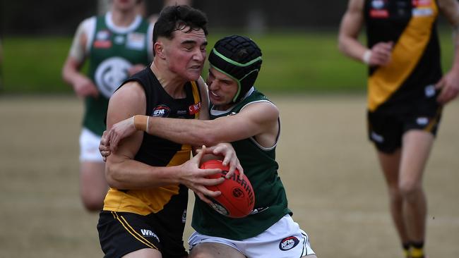 Heidelberg’s Jack Andrew is tackled by Jackson Hasler. Picture: Andrew Batsch