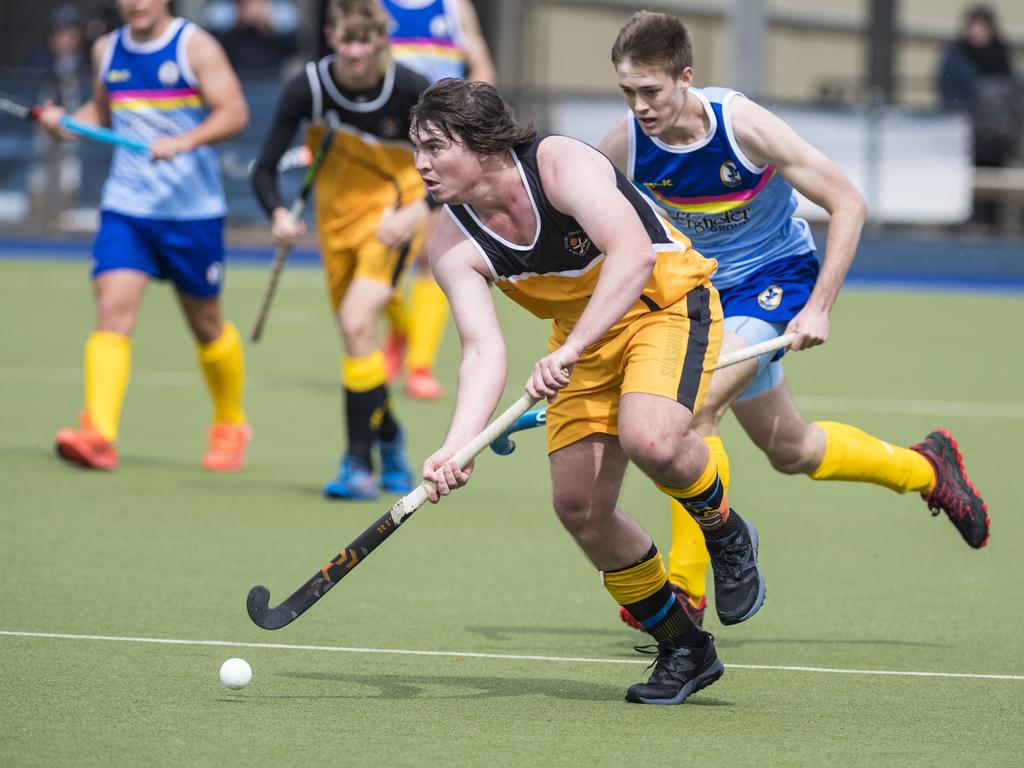 Christian Ramsay (front) of Sunshine Coast under pressure from Hayden Dorge of Toowoomba 1 in Hockey Queensland Championships at Clyde Park, Sunday, May 2, 2021. Picture: Kevin Farmer