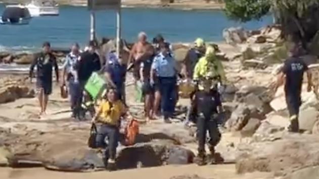 A woman has been rushed to hospital after being bitten by a shark at Gunyah Beach, near Bundeena, in Port Hacking NSW.