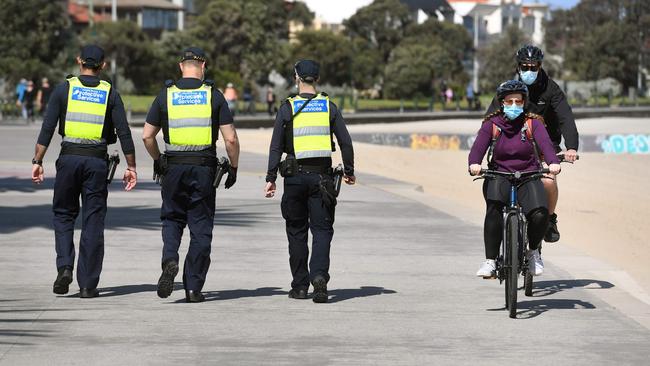 Protective services officers patrol St Kilda Beach. Picture: AFP