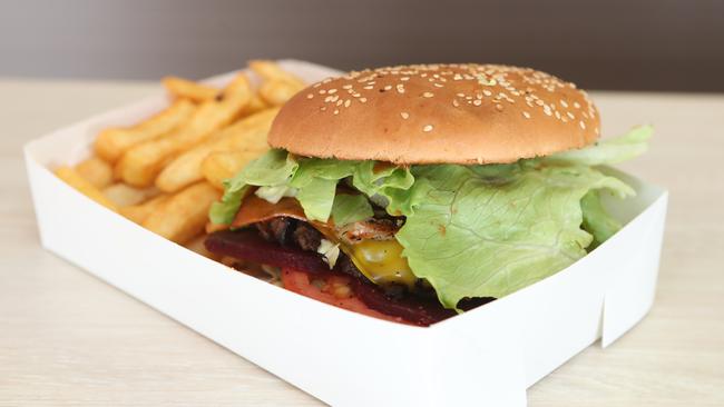 The burger with the lot: Beefless patty, melted cheese, bacon, pineapple, beetroot, lettuce, pickles, tomato, grilled onion, bbq and tomato sauce. Picture: Richard Gosling