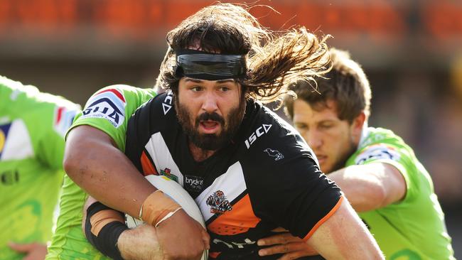 Tigers Aaron Woods is tackled during the Wests Tigers v Canberra Raiders rugby league game at Leichhardt Oval, Sydney. Pic Brett Costello