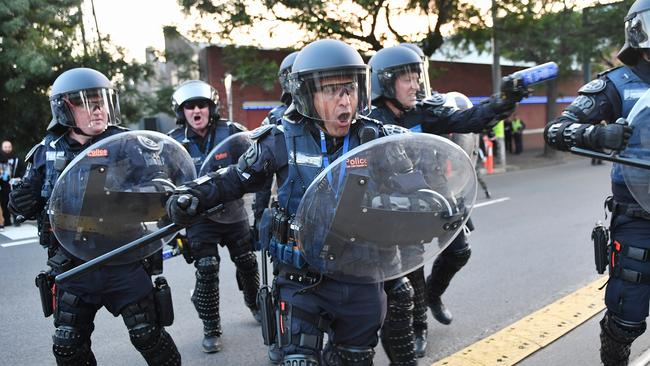 A police officer was injured when he was hit with a rock. Picture: Jake Nowakowski