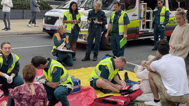 Emergency services treating patients for smoke inhalation. Picture: Queensland Ambulance Service (QAS)