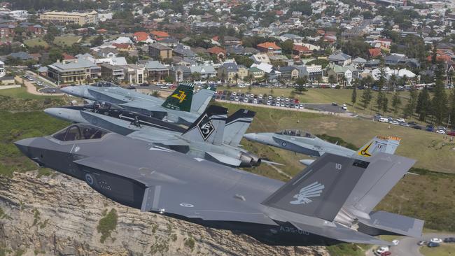 Royal Australian Air Force F/A-18 Hornets fly in formation with an F-35A Joint Strike Fighter over Newcastle, NSW. Picture: Supplied