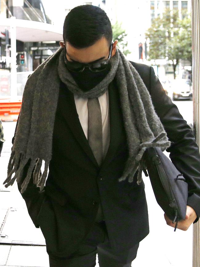 He has attempted to avoid being photographed while leaving court. Picture: NewsWire / John Appleyard