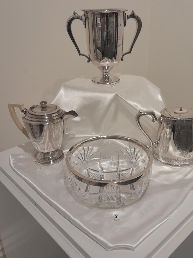 Evocative of an era now gone by, silver ware was often awarded for outstanding achievements. These are from the late 1800s and early 1900s. Norwood footy fans have until the end of the month to soak up a fascinating display of historic memorabilia. Picture: Supplied