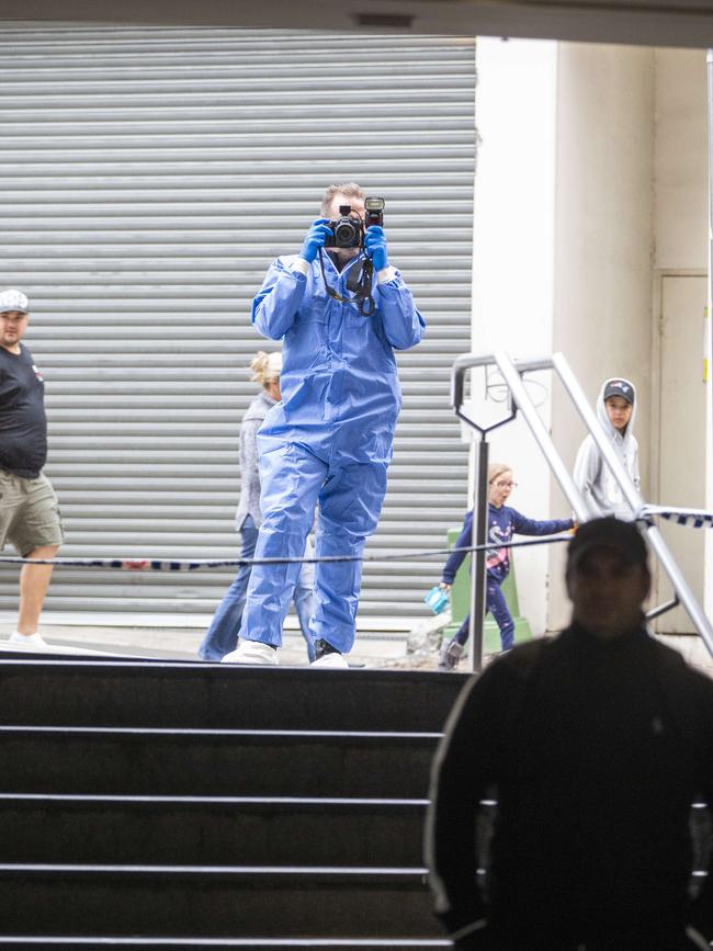 A forensics officer takes images