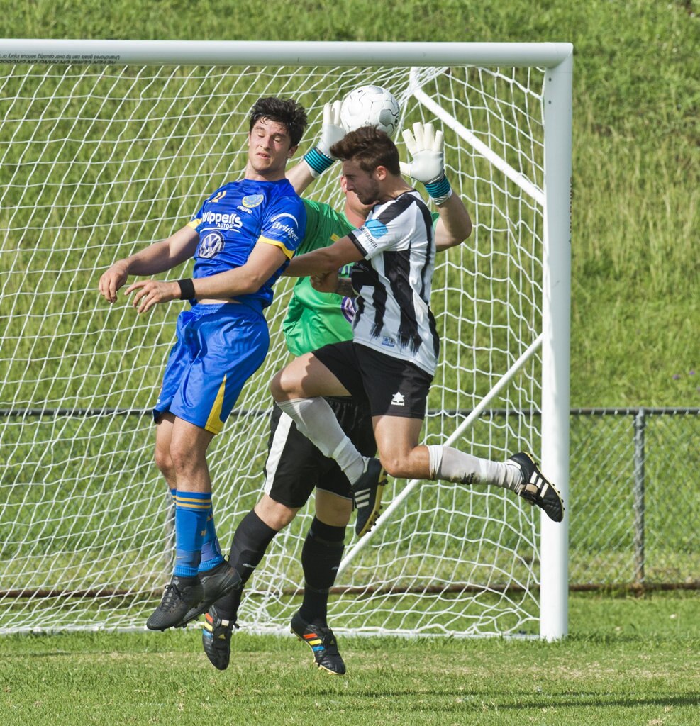 Alex Dyball, USQ and Matt Eilers, USQ and Nikolas Lawson, Willowburn. Football, Willowburn vs USQ. Sunday, 4th Mar, 2018. Picture: Nev Madsen