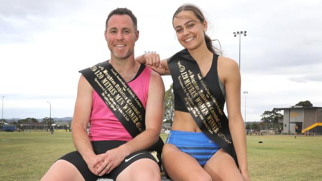 Winner of the men’s 120m Brighton Gift race Clinton Gray with Taylah Stallan who won the women’s 120m sprint. Picture: Dean Martin