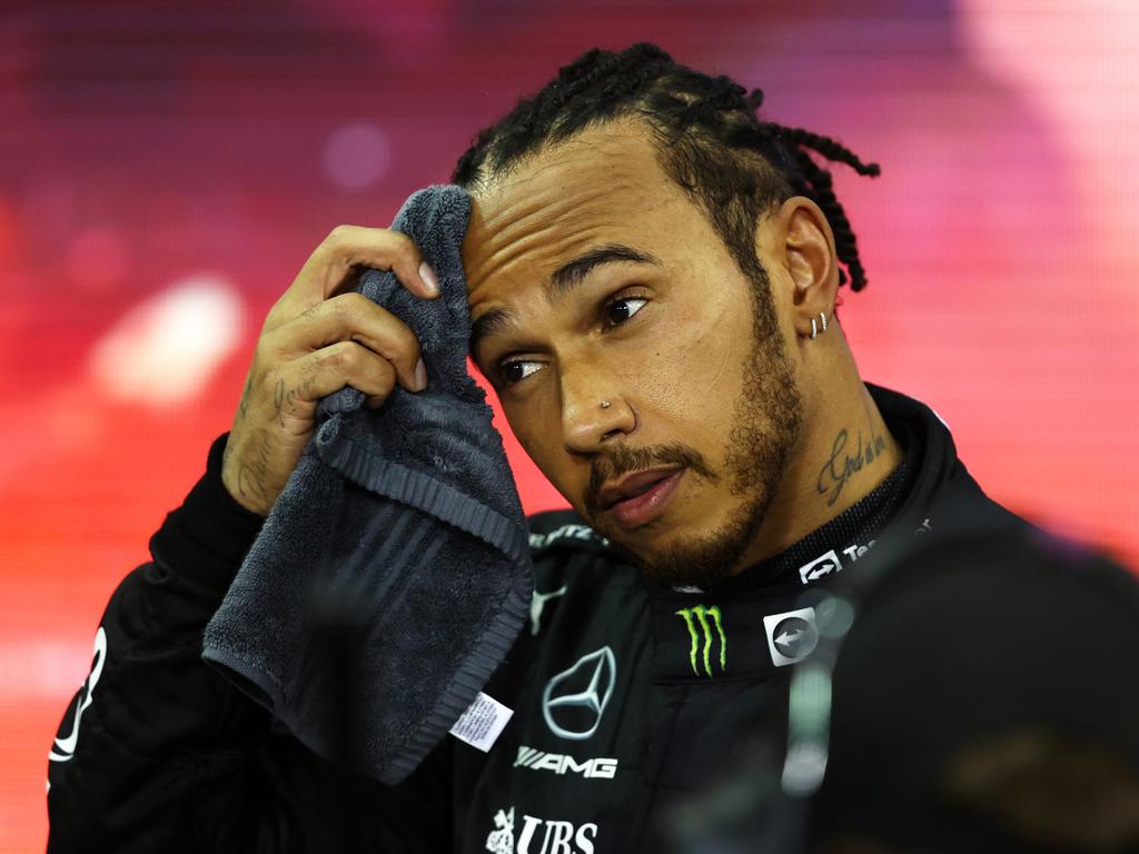 ABU DHABI, UNITED ARAB EMIRATES - DECEMBER 12: Second placed and  championship runner up Lewis Hamilton of Great Britain and Mercedes GP looks dejected in parc ferme  during the F1 Grand Prix of Abu Dhabi at Yas Marina Circuit on December 12, 2021 in Abu Dhabi, United Arab Emirates. (Photo by Bryn Lennon/Getty Images) *** BESTPIX ***