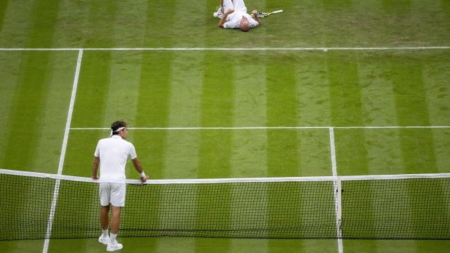 Adrian Mannarino of France reacts as he goes down with an injury in his Men's Singles First Round match against Roger Federer of Switzerland during Day Two of The Championships - Wimbledon 2021. Picture: Getty