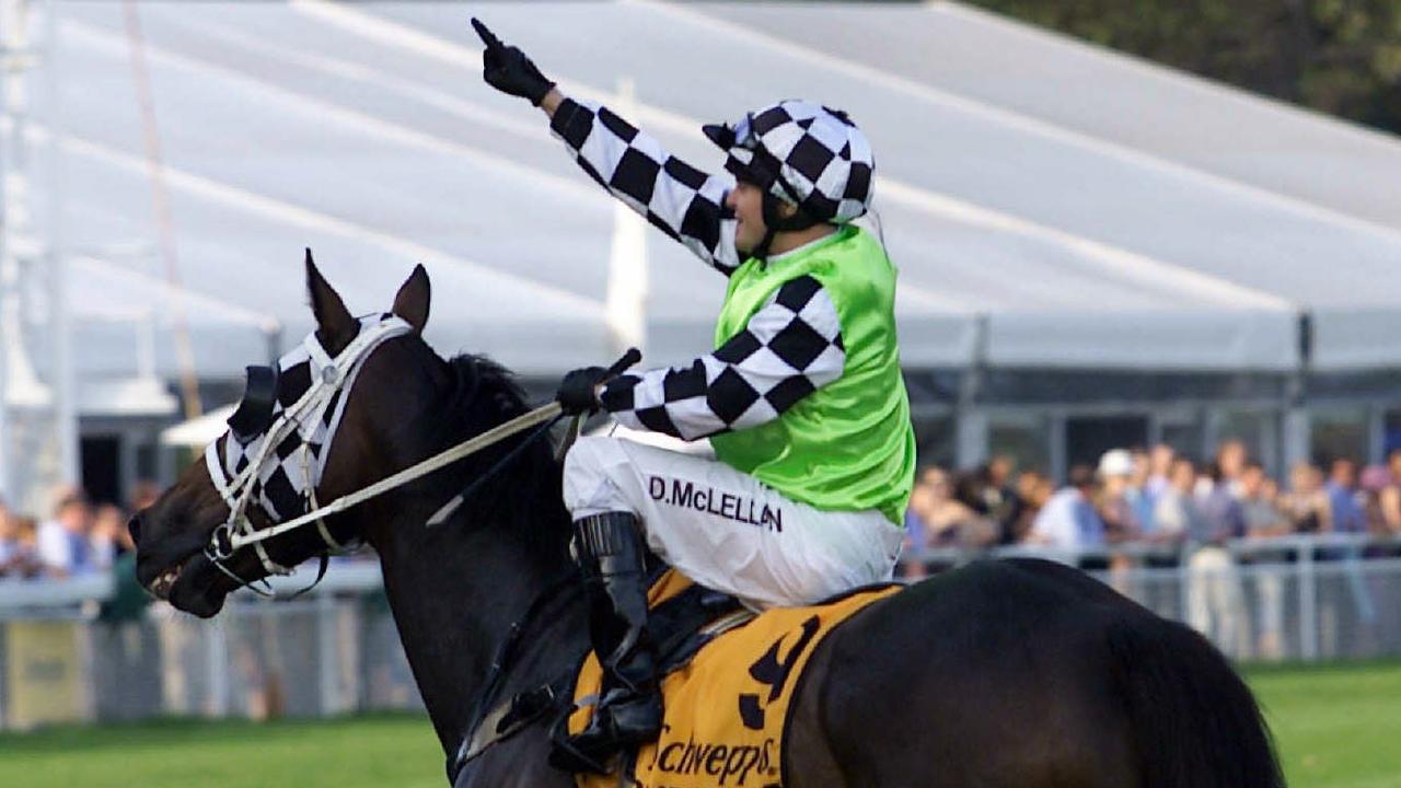 APRIL 13, 2002 : Jockey Darryl McLellan on racehorse Henderson Bay salutes to crowd after winning race 6, Sydney Cup at Randwick, 13/04/02. Pic Roy Haverkamp. Turf