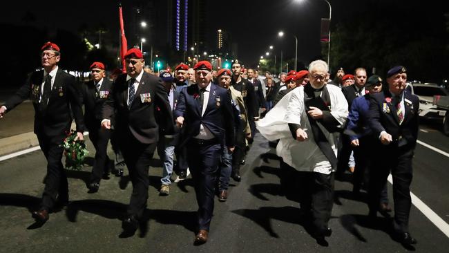 An unauthorised march makes its way down the Gold Coast Highway after the Dawn Service in Southport last year. Picture: Glenn Hampson.