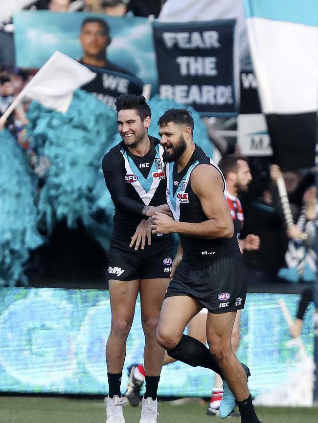 Chad Wingard laughs with Paddy Ryder after he goaled with a soccer kick against St Kilda. Picture Sarah Reed