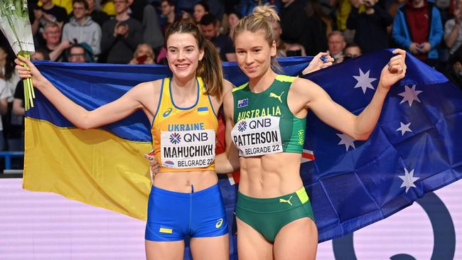 Yaroslava Mahuchikh with Australia's Eleanor Patterson after the women's high jump final during The World Athletics Indoor Championships at the Stark Arena in Belgrade. Picture: AFP