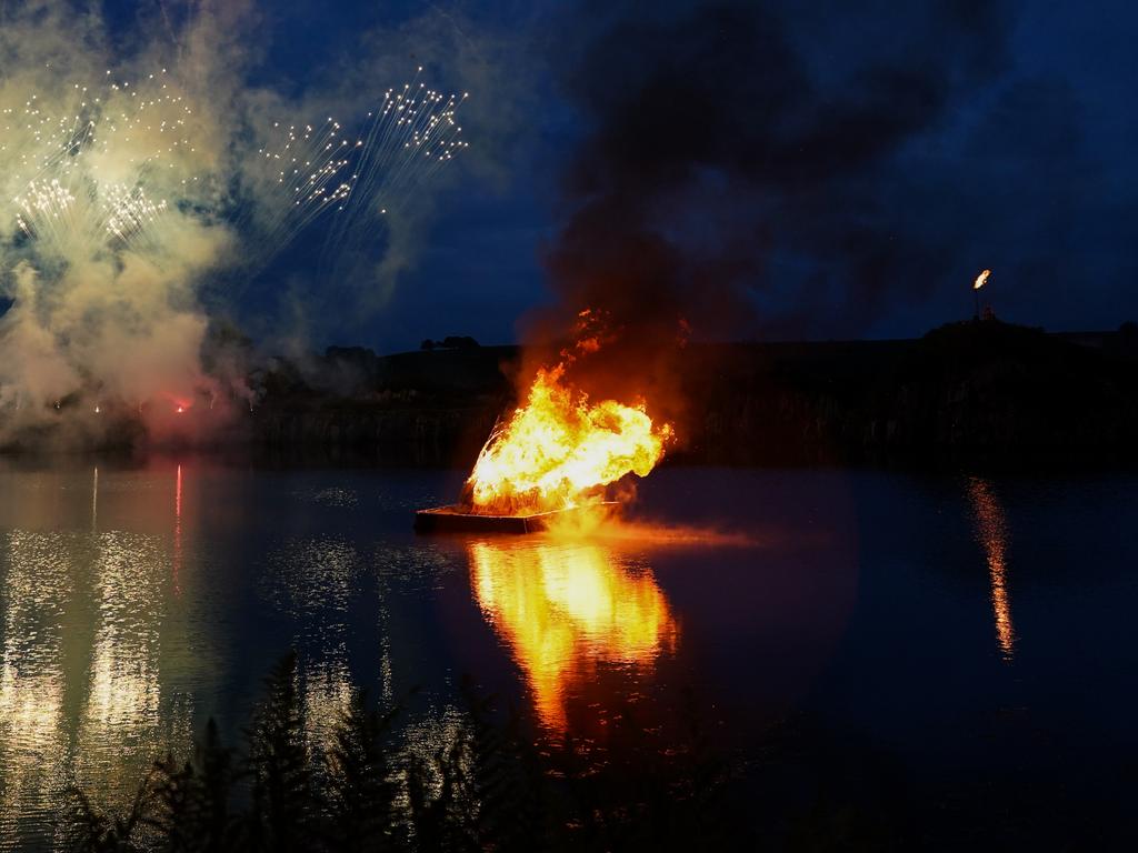 Roman archers fire flaming arrows into a floating beacon on the lake during the Queen’s Platinum Jubilee Beacon Lighting Ceremony at Cawfield Quarry on Hadrian.