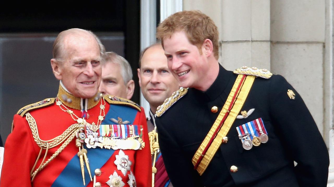 Prince Harry shares a laugh with Prince Philip in 2014. Picture: Getty Images