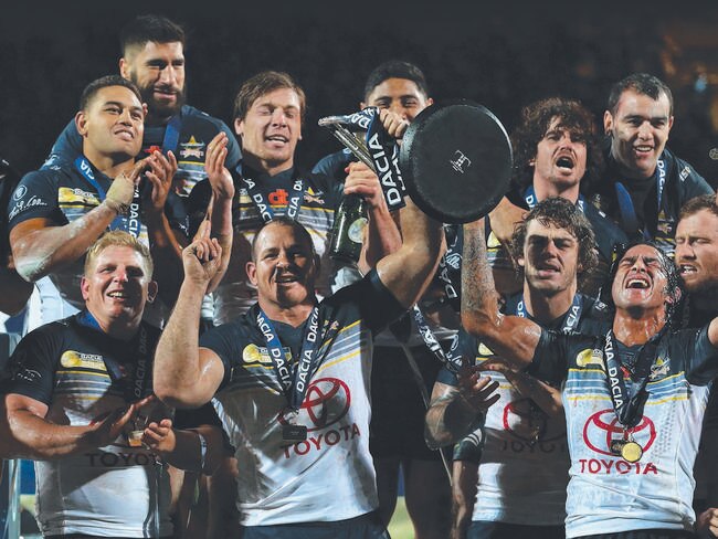 LEEDS, ENGLAND - FEBRUARY 21: Johnathan Thurston and Matthew Scott of North Queensland Cowboys lift the World Club Series trophy after victory over Leeds Rhinos in the World Club Series match between Leeds Rhinos and North Queensland Cowboys at Headingley on February 21, 2016 in Leeds, England. (Photo by Alex Livesey/Getty Images)