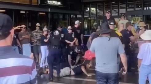 Mackay police arrested a number of men after members of an anti vaccination rally entered the busy shopping centre.