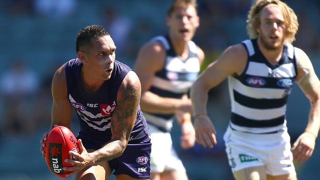 PERTH, AUSTRALIA - MARCH 12: Harley Bennell of the Dockers gathers the ball during the NAB Challenge match between the Fremantle Dockers and the Geelong Cats at Domain Stadium on March 12, 2016 in Perth, Australia.  (Photo by Paul Kane/Getty Images)