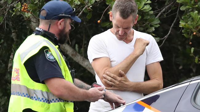 Police speak to the driver of the vehicle who allegedly returned a positive roadside drug test. Picture Glenn Hampson