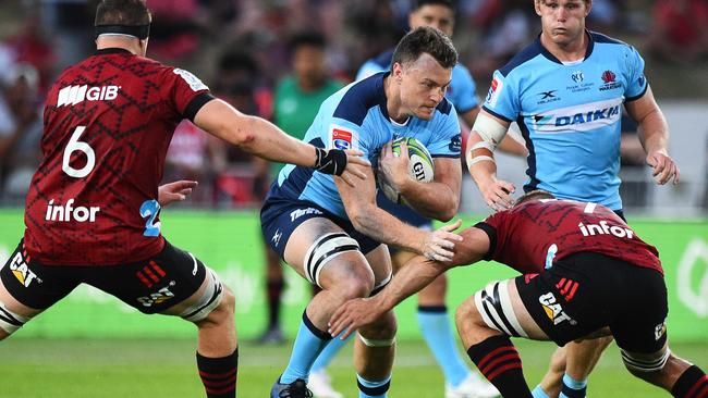 Jack Dempsey taking on the tackler when the NSW Waratahs played the Canterbury Crusaders in February. Picture: AAP