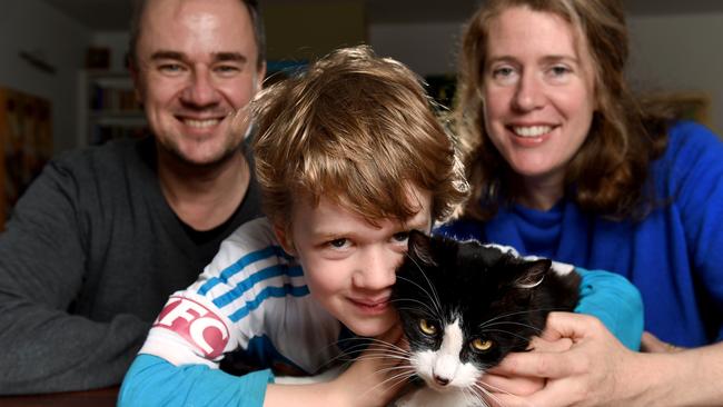 Thomas Rivers, with dad Justin and mum Zoe, started reading at four. Picture : Mike Keating