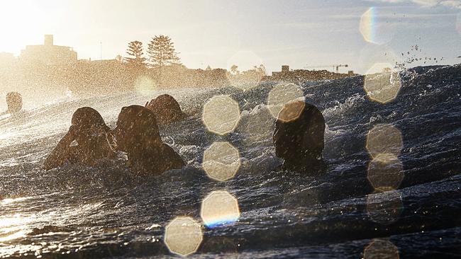 Girls in the surf at Bondi. Pic: Paul Blackmore.