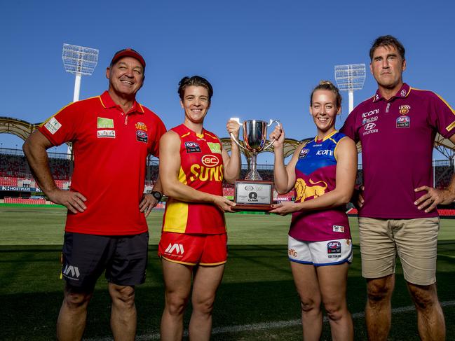 The Suns and Lions are going head to head on Saturday in the first AFLW Q-Clash.  Suns coach David Lake, Suns Sam Virgo, Lions  Lauren Arnell and Lions Craig Starcevich at Metricon Stadium, Picture: Jerad Williams