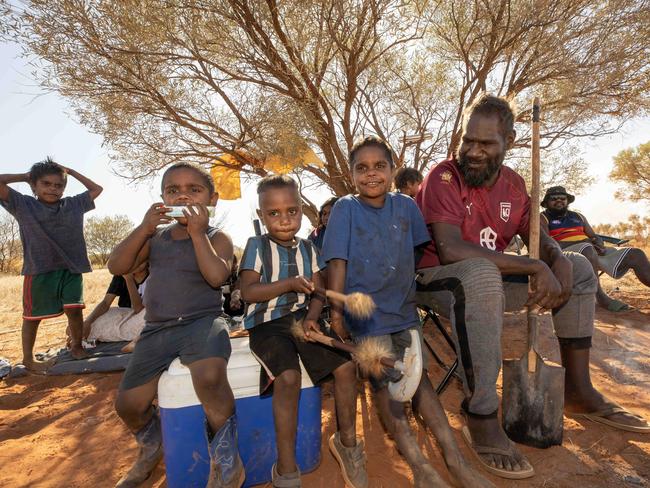 15-10-2023 - Graham Hoosan, 34, with relatives Zharick Jack, 7 (collared shirt) Hussain,3 (striped - GrahamÃ¢â¬â¢s son) Matthew Lynch Jn, 3, Raymond Jack, 5 (blue shirt no collar) at the horse races in Santa Teresa on Sunday. They travelled from Old TimerÃ¢â¬â¢s Village on the outskirts of Alice Springs. Picture: Liam Mendes / The Australian