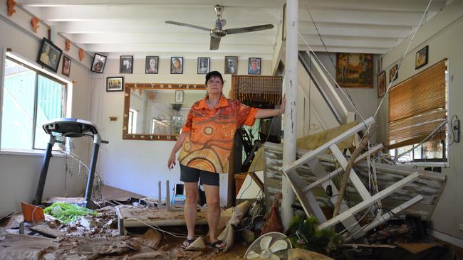 Lindy Ashworth and her husband Gary face an overwhelming task cleaning their home, left broken and chaotic and under a thick layer of mud following the flood. Picture: Bronwyn Farr