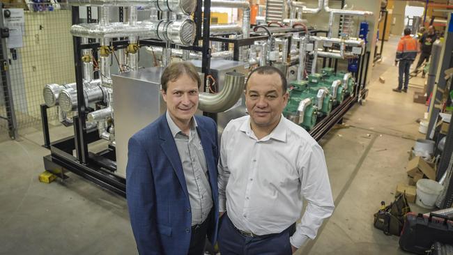 UniSA professor Frank Bruno with Glaciem chief executive Julian Hudson in front of the heat pump. Pic: Roy Van Der Vegt