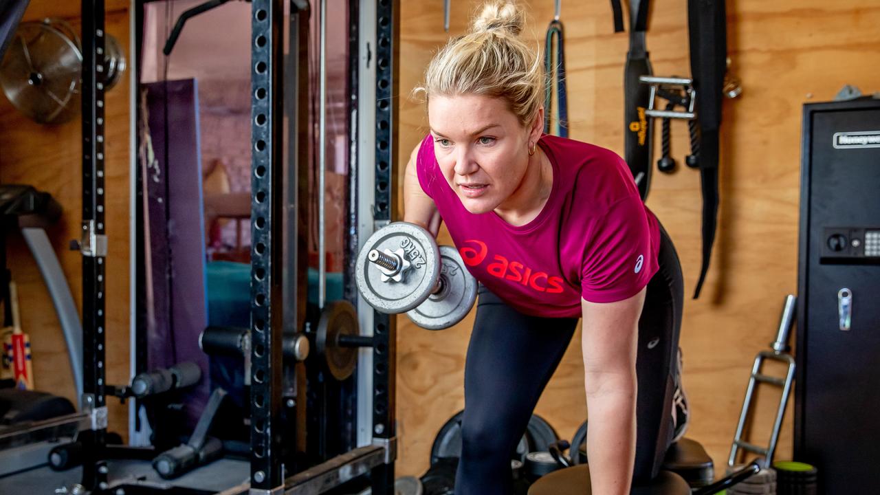 Stevens working out at home while recovering form her spinal injury. Picture: Luke Marsden.