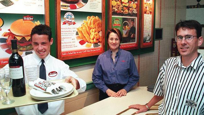 New Sizzler employee Jared Herring with general manager Lyn Levinge and IPA Personnel branch manager Nic Farman in 2001. Picture: Barry Leddicoat.