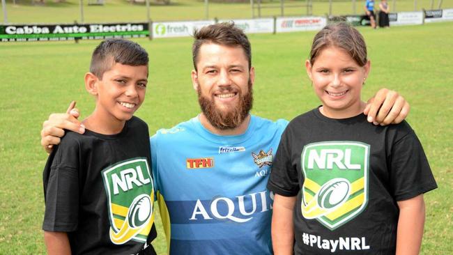 Titans' player Matt Robinson with Tweed twins Jyungarah Pearce, 11 and Kiala Pearce, 11 at the Titans' NRL School Holiday Footy Clinic at Cudgen Fields on Tuesday, April 19. Picture: Daniel McKenzie