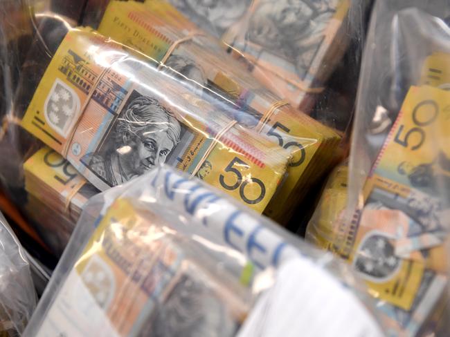 Cash seized as part of the raids. Picture: AAP