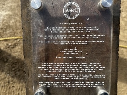 A plaque with a description in loving memory of the slain surfers. Picture: Instagram