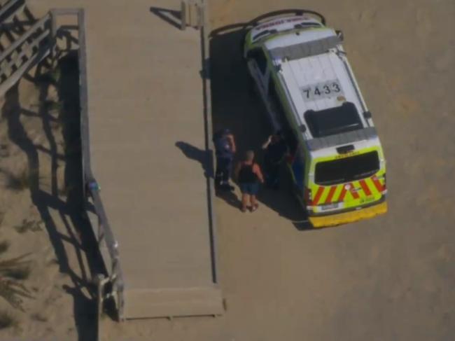 An ambulance at the scene where a man drowned. Picture: 9 News