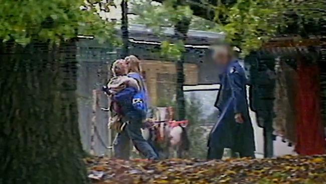 Screenshots from Channel 9's A Current Affair footage of Children of God raids from the 90s in Melbourne. Picture: Channel 9