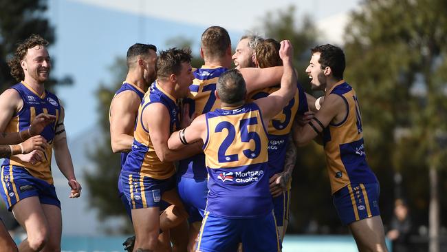 Sunshine’s Nathan Carroll celebrates his 100th goal. Picture: Andrew Batsch