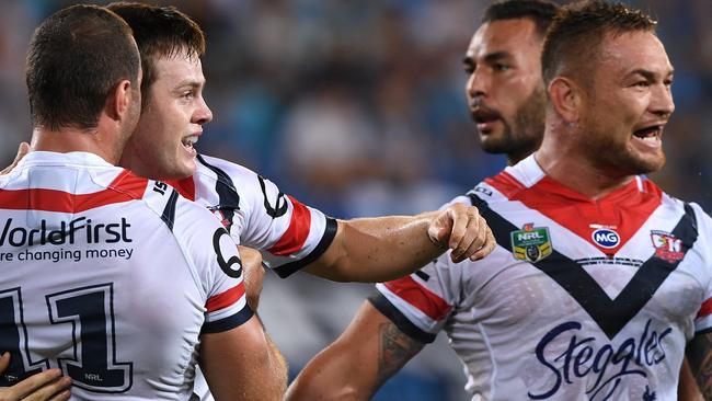Roosters player Luke Keary reacts after scoring a try.