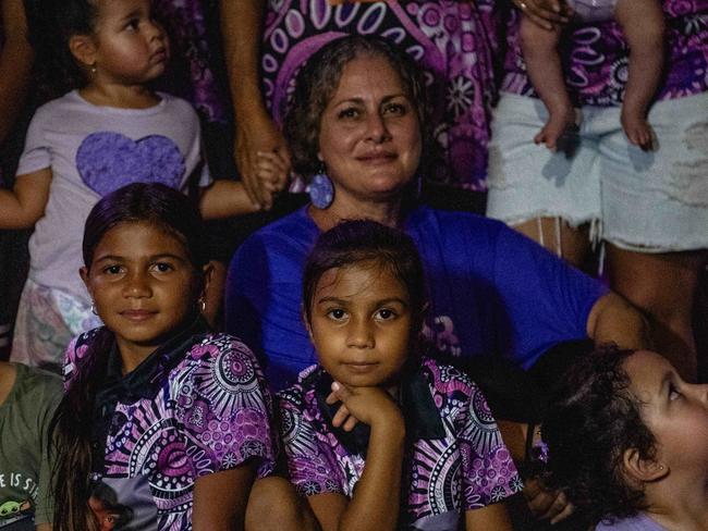 Tara May, the mother of 19-year-old Kailah May who drowned as a result of an epileptic fit in 2022 was surrounded by loved ones under the purple lights of the Darwin Convention Centre on Tuesday March 27 for  Epilepsy Awareness Day. Picture: Zizi Averill